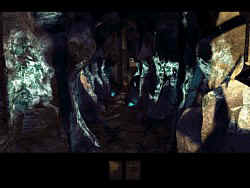 The path through the rocks is iluminated by blue lights